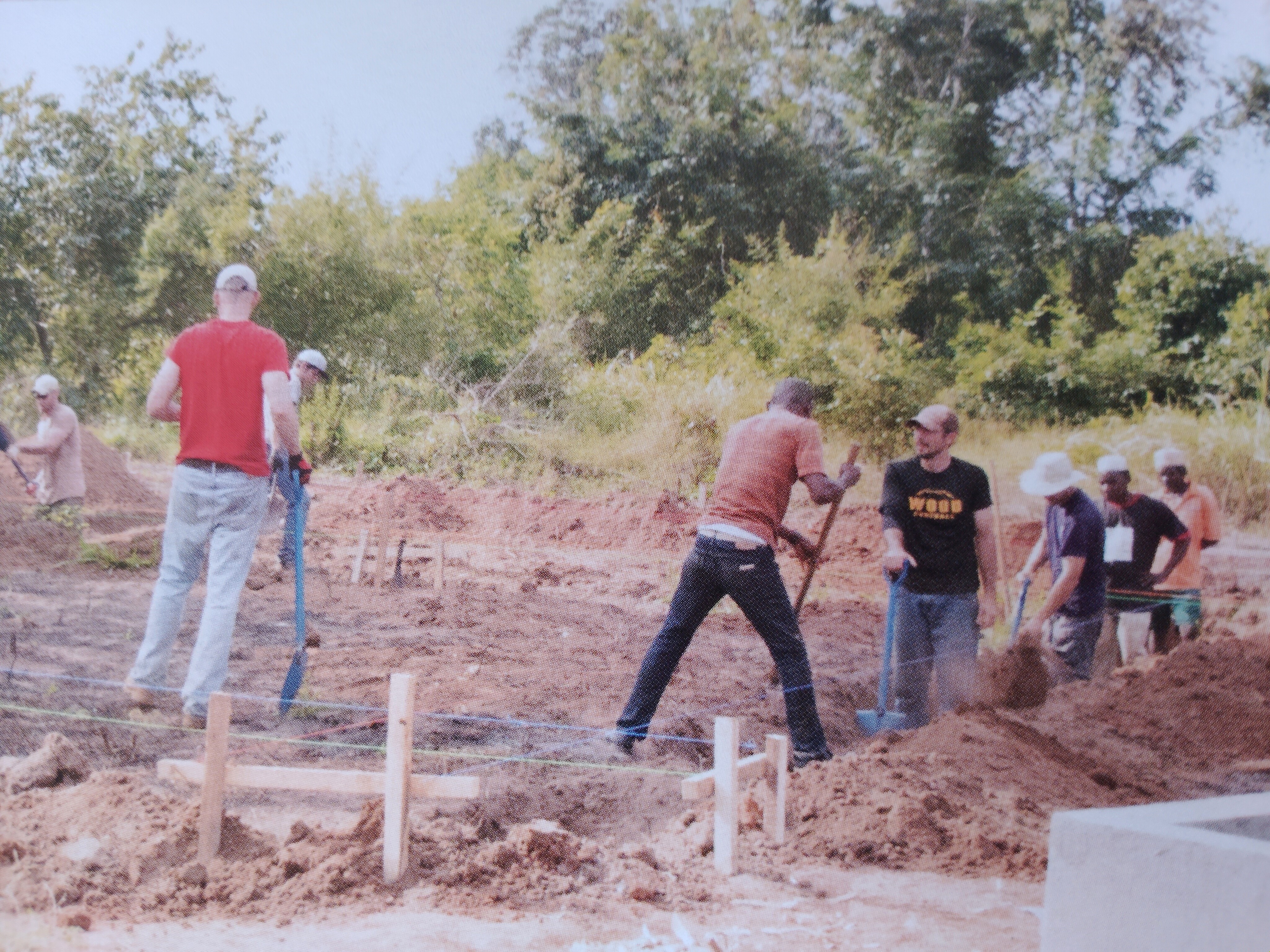Jonathan and crew digging trenches for the agricultural research center foundation in Tanzania